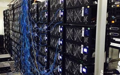 An expansive cryptocurrency mining farm nestled in a snowy Canadian landscape