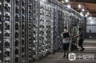 Aerial view of a large cryptocurrency mining farm with rows of mining machines